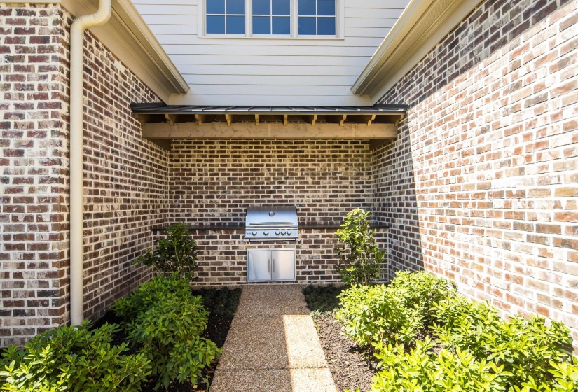 View of exterior entry with brick siding
