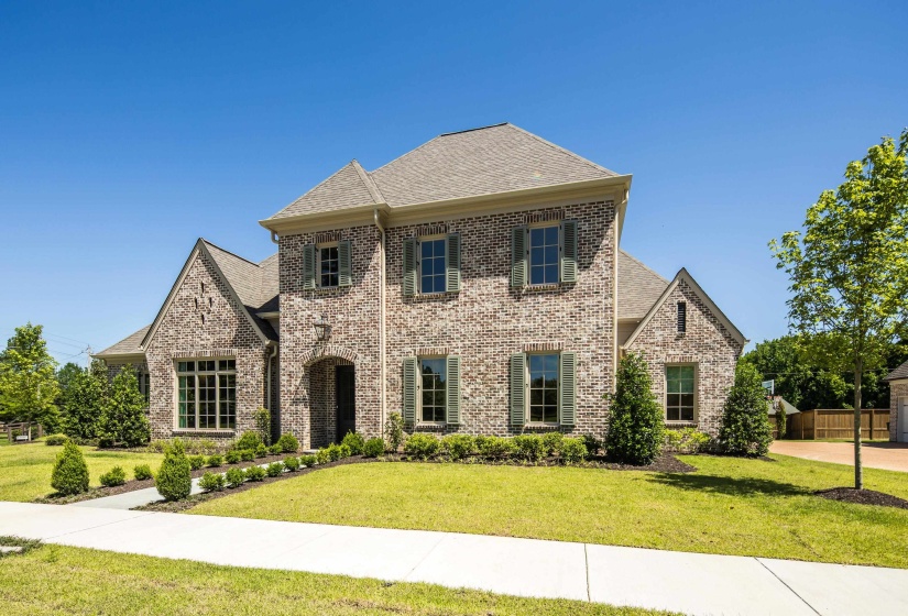 View of front of property with brick siding and a shingled roof