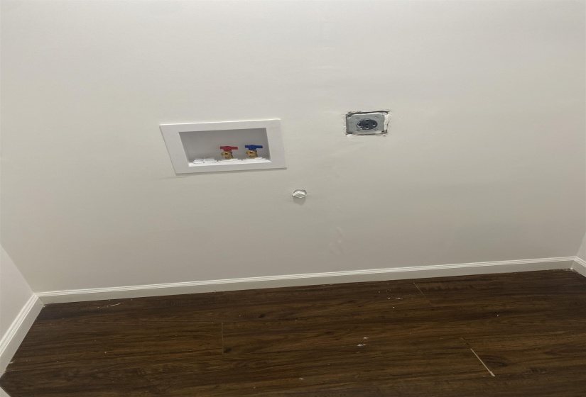 Laundry room featuring hookup for an electric dryer, laundry area, baseboards, and hookup for a washing machine