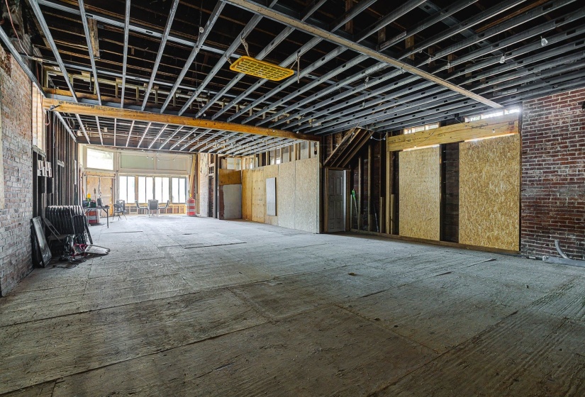Miscellaneous room with brick wall