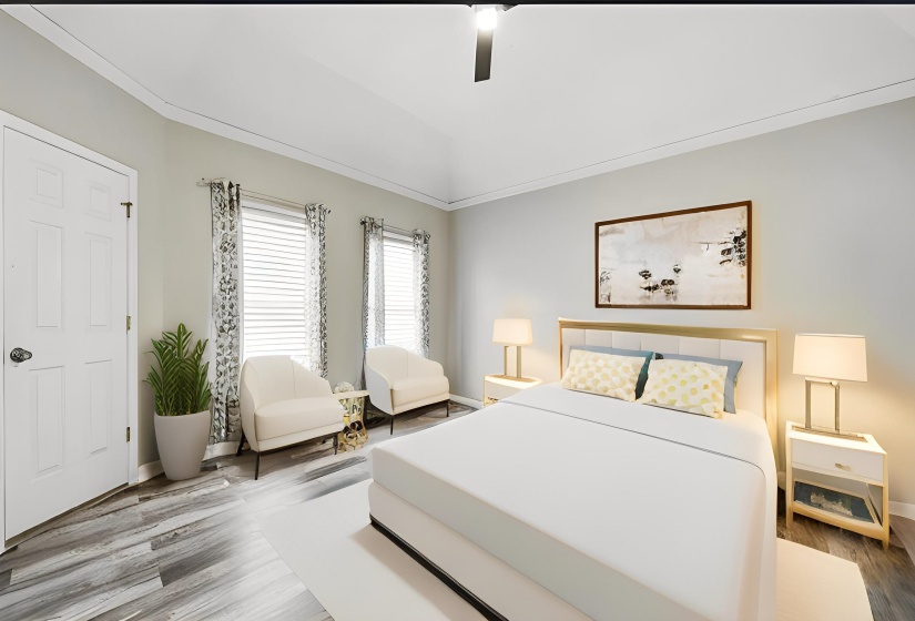 Bedroom with crown molding, wood finished floors, ceiling fan, and vaulted ceiling