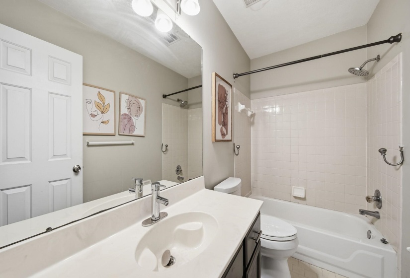 Full bath with vanity and bathtub / shower combination