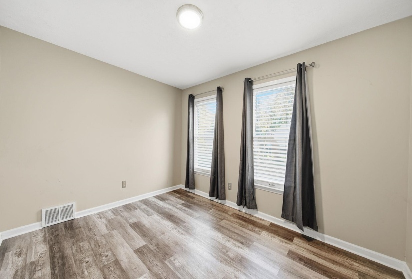 Unfurnished room featuring light wood-type flooring and baseboards