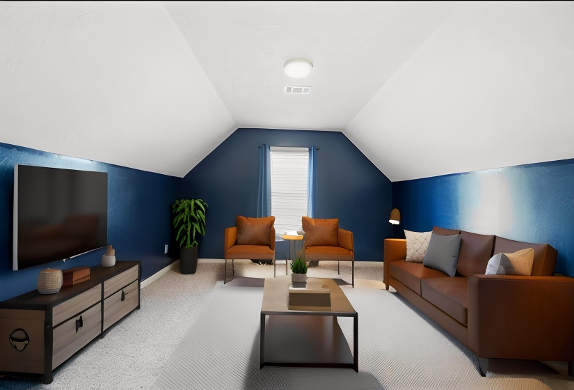 Carpeted living area with baseboards