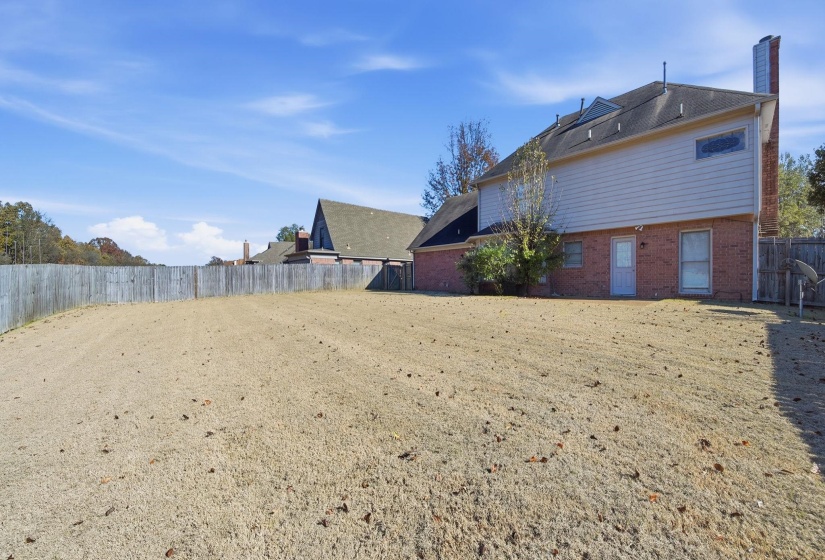 View of fenced backyard