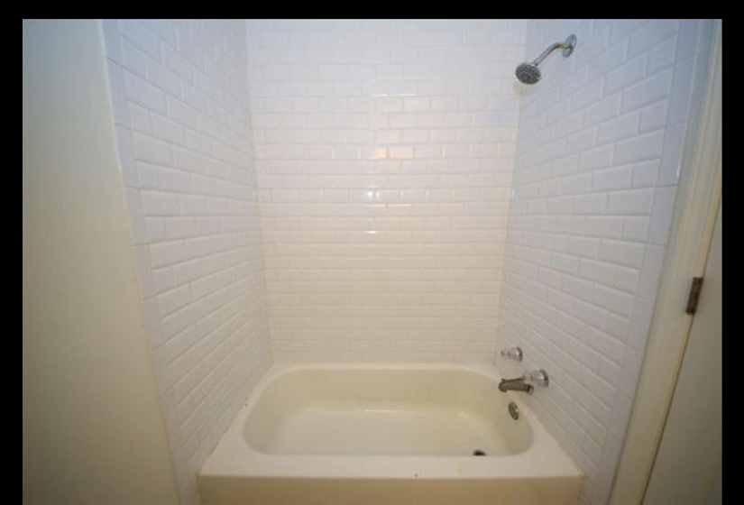 Bathroom with bathing tub / shower combination