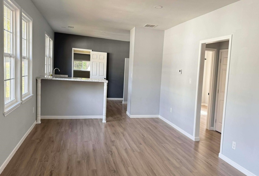 Unfurnished room with baseboards and light wood finished floors