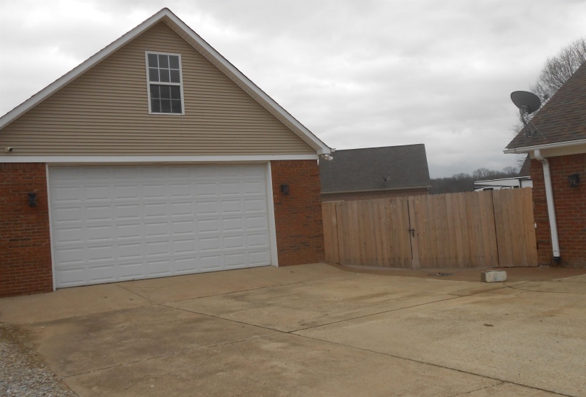 Garage featuring driveway