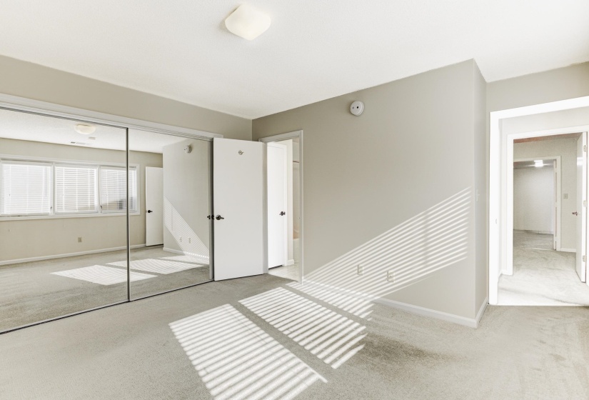 Unfurnished bedroom featuring carpet floors and a closet