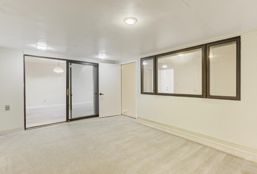 Unfurnished room featuring carpet floors and baseboards