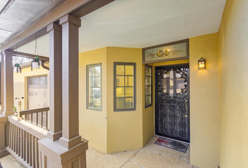 View of exterior entry with stucco siding