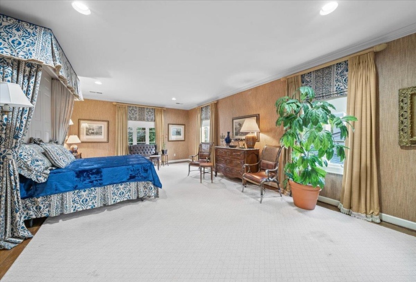 Carpeted bedroom featuring recessed lighting and ornamental molding