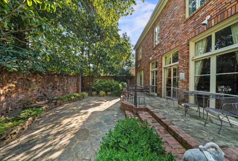 Fenced backyard with a patio