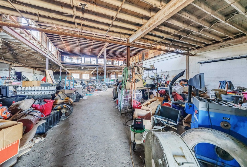 Miscellaneous room featuring unfinished concrete floors