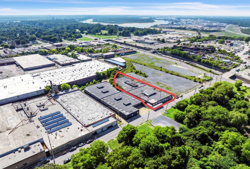 View of property location with an industrial area and property boundaries highlighted