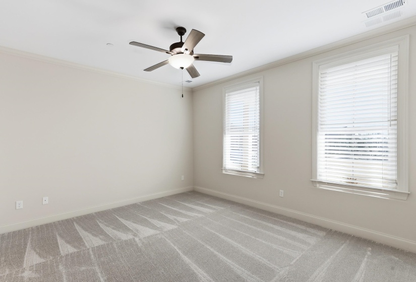 Master Bedroom situated on first floor with windows facing front of structure