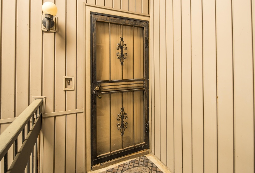 Doorway to property with board and batten siding