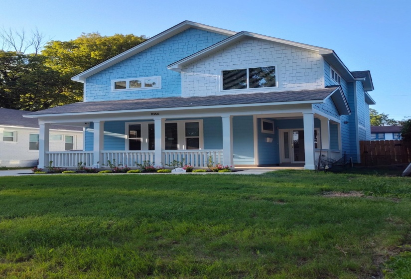 Lush landscaping, lots of parking on the side and in the back of the house. Fenced-in yard and a security metal gate to lock your cars in the back