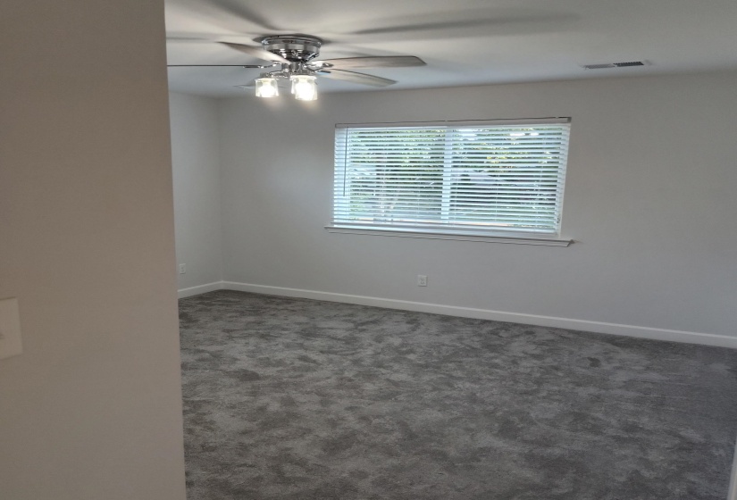 All bedrooms have an updated ceiling light fan and plush carpet.  The first floor flex room can be used as a bedroom, office or whatever you desire.