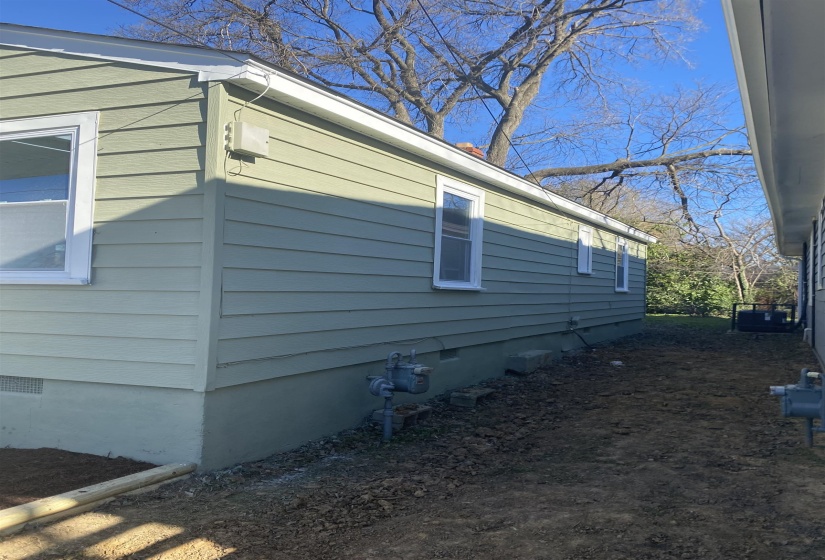 View of side of property featuring crawl space
