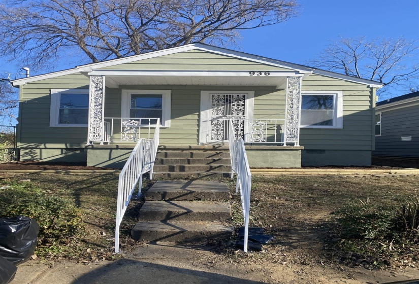View of front facade with covered porch and crawl space