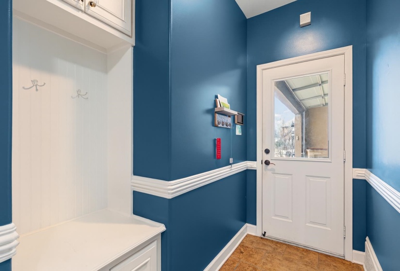 Doorway featuring baseboards