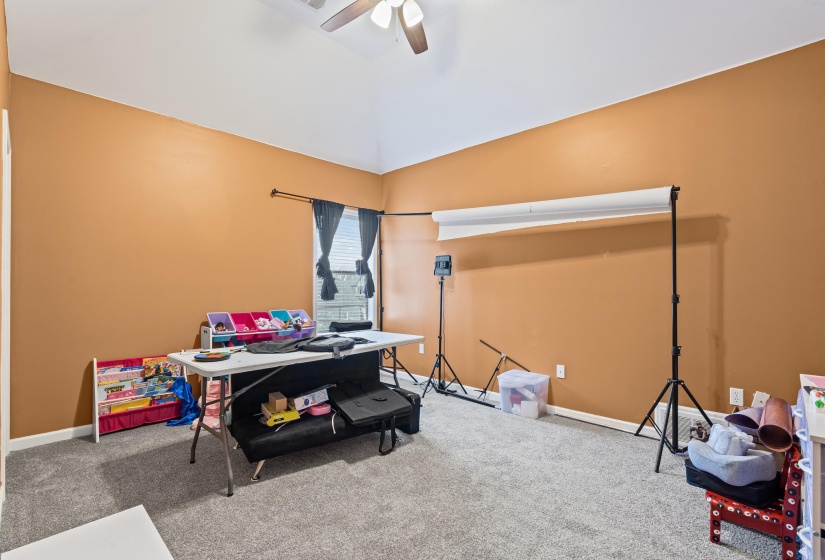 Playroom with carpet, lofted ceiling, and ceiling fan