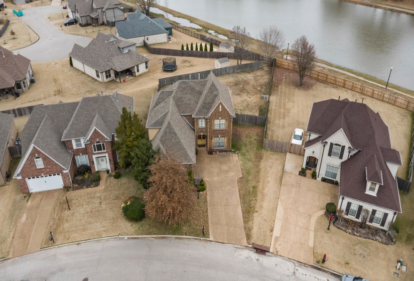 Aerial view of residential area featuring a large body of water