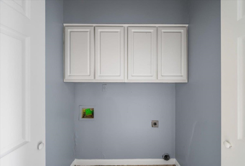 Laundry room featuring cabinet space, washer hookup, and electric dryer hookup