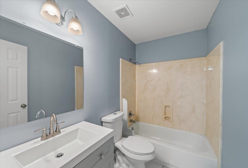 Full bathroom with vanity and  shower combination