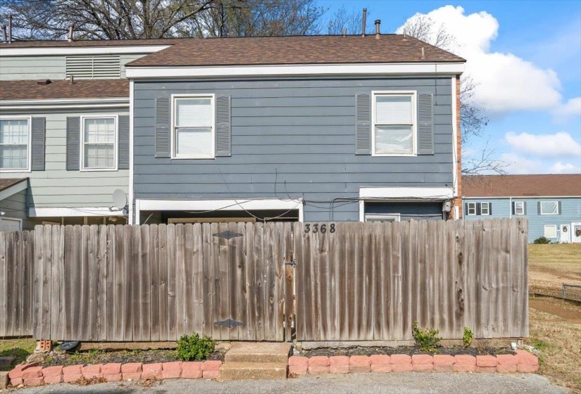 View of property exterior with a shingled roof