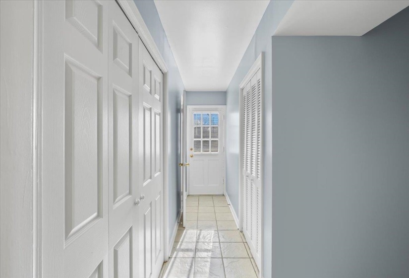 Corridor featuring baseboards