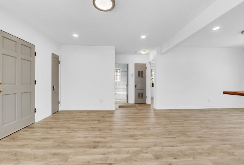 Spare room featuring light wood-type flooring and recessed lighting
