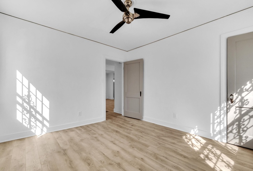 Unfurnished room with light wood-style flooring and a ceiling fan