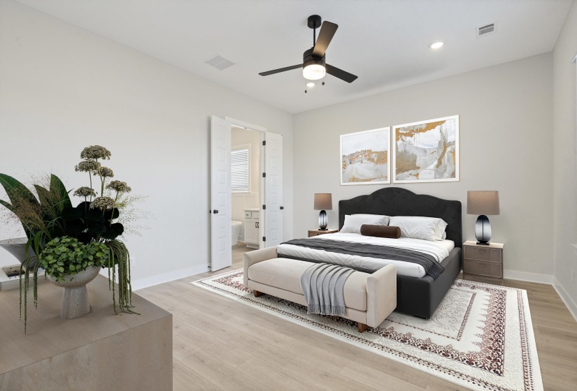 Spacious bedroom featuring light wood-finish flooring, recessed lighting, and a ceiling fan