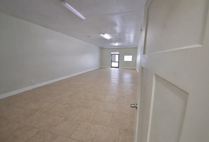 Spare room featuring baseboards