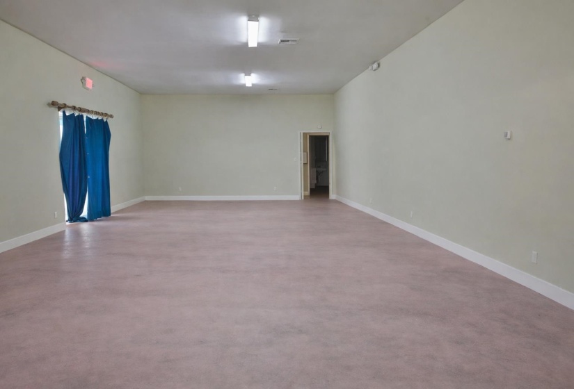 Spare room featuring baseboards
