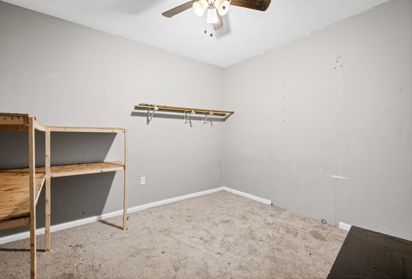 Storage area featuring a ceiling fan