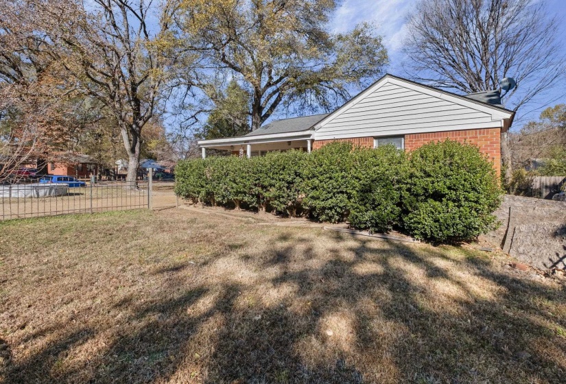 View of side of home featuring brick siding