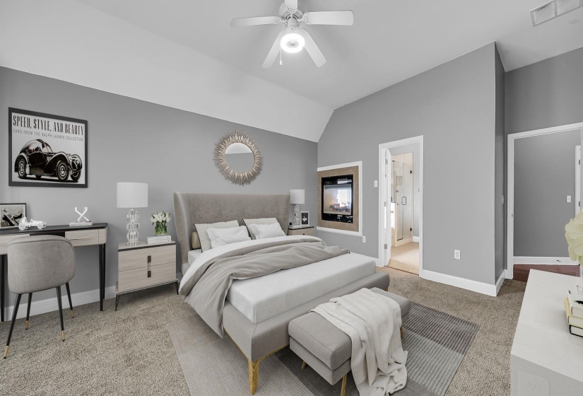 Vaulted ceiling room featuring light gray walls, built-in electric fireplace, carpeted flooring, and a ceiling fan