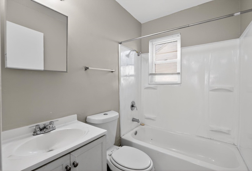 Full bathroom featuring vanity and bathing tub / shower combination