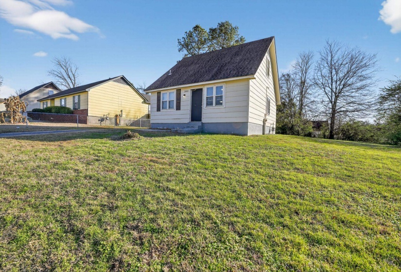 View of front of house featuring a shingled roof