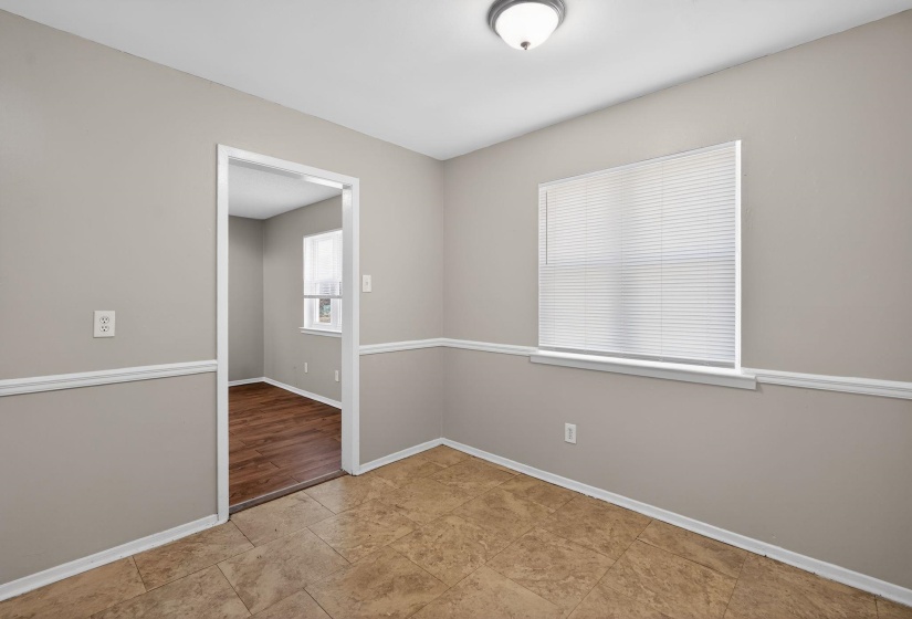 Empty room featuring baseboards