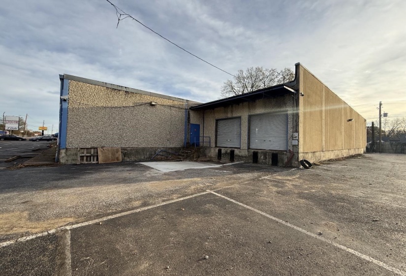 Rear view of house featuring uncovered parking
