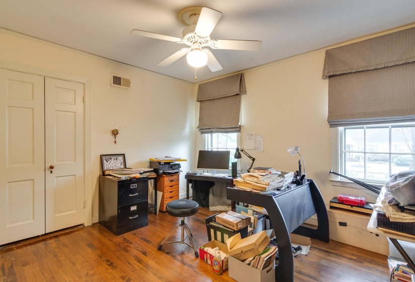 Office space featuring hardwood / wood-style floors and ceiling fan