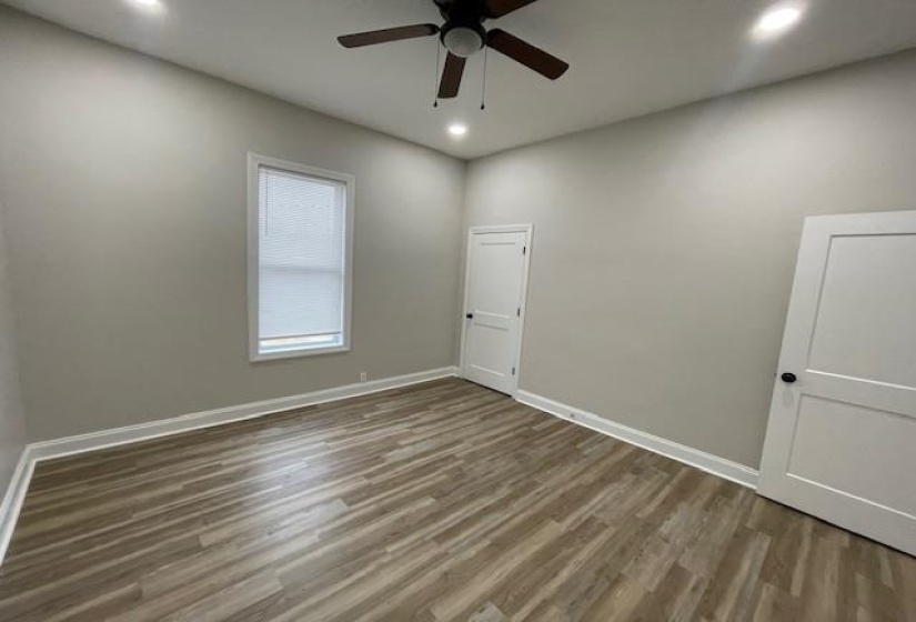 Empty room featuring wood finished floors, recessed lighting, and ceiling fan