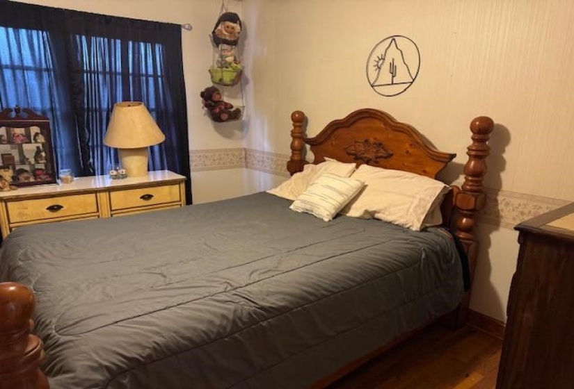 Bedroom featuring wood finished floors