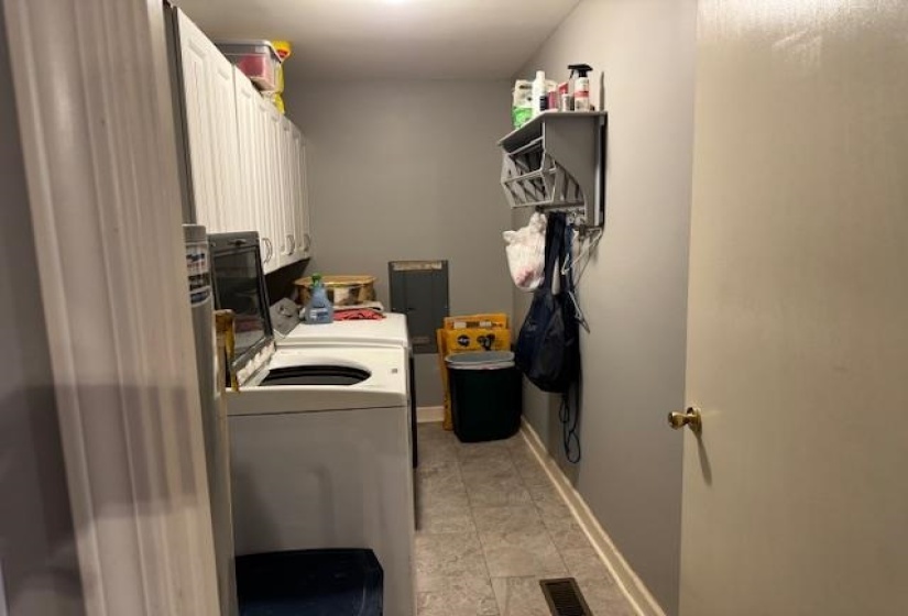 Laundry area with washing machine and clothes dryer and cabinet space