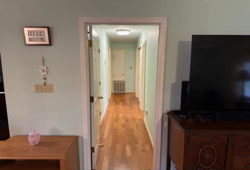 Hall featuring light wood-type flooring
