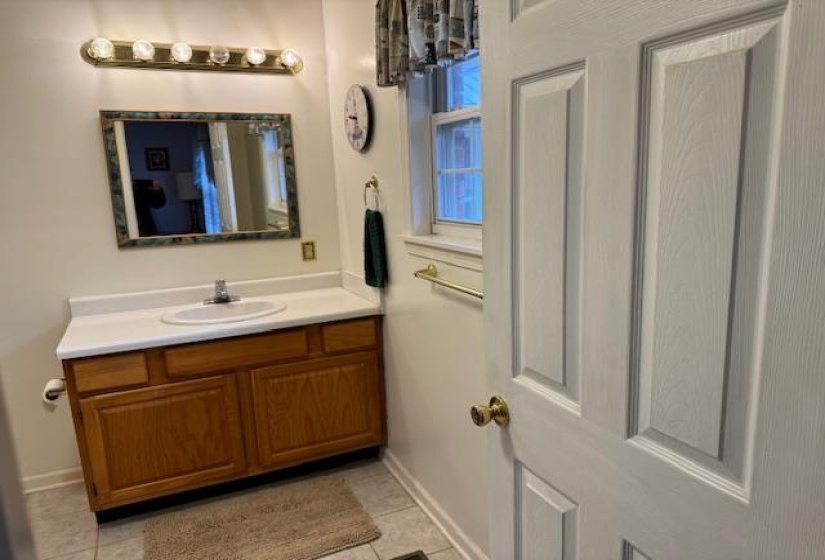 Bathroom featuring vanity and light tile patterned flooring